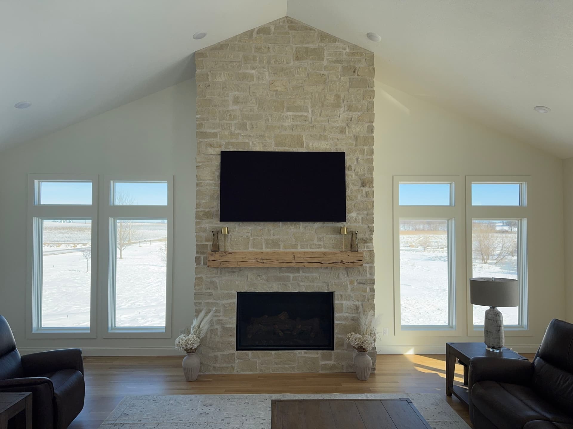 Cozy Living Room Transformation with Stone Fireplace image